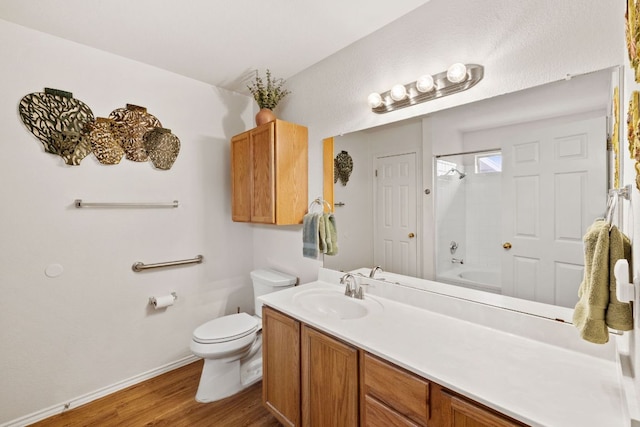 3919 Haleys Way, Round Rock, TX 78665 - bathroom with toilet, wood finished floors, vanity, bathing tub / shower combination, and baseboards