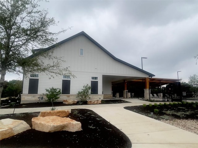 2316 Gold Dust Trl, Leander, TX 78641 - back of property with stone siding and covered porch