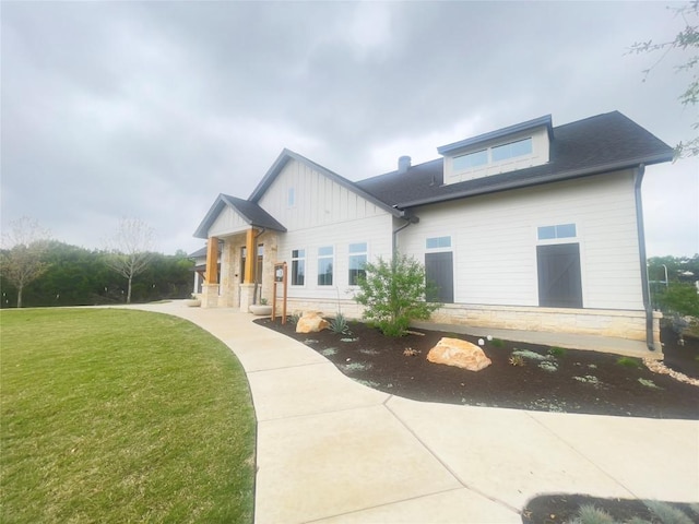 2316 Gold Dust Trl, Leander, TX 78641 - modern inspired farmhouse featuring a front lawn, board and batten siding, and stone siding