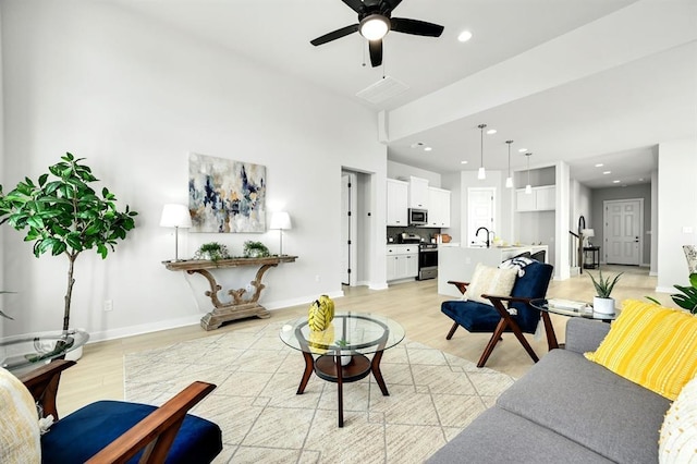 2316 Gold Dust Trl, Leander, TX 78641 - living room featuring ceiling fan, light wood finished floors, and recessed lighting