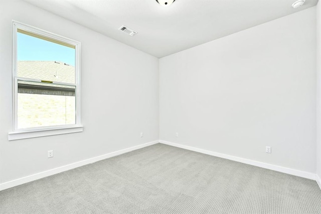2316 Gold Dust Trl, Leander, TX 78641 - empty room with plenty of natural light, carpet floors, and a smoke detector
