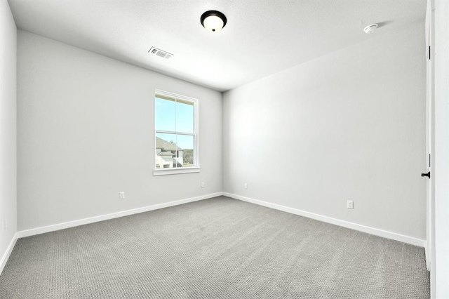2316 Gold Dust Trl, Leander, TX 78641 - unfurnished room with dark carpet and a smoke detector