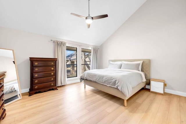 207 Lasso St, Horseshoe Bay, TX 78657 - bedroom with wood finished floors, ceiling fan, and high vaulted ceiling
