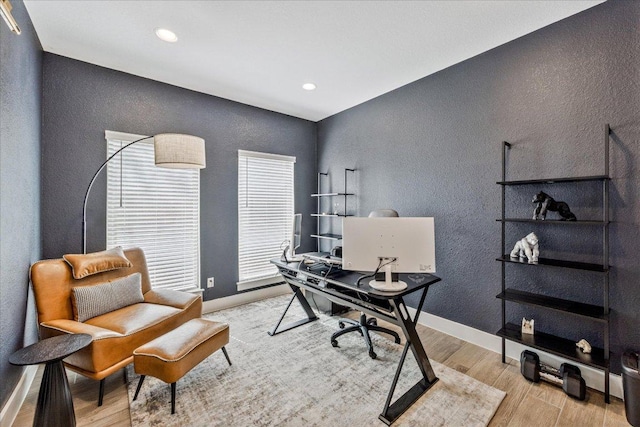 office area featuring recessed lighting, a textured wall, baseboards, and wood finished floors