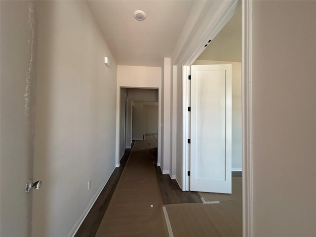 8213 Grenadier Dr, Austin, TX 78738 - hallway with dark wood-type flooring and baseboards