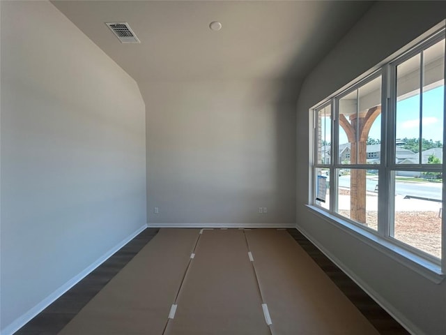 8213 Grenadier Dr, Austin, TX 78738 - spare room with baseboards and lofted ceiling