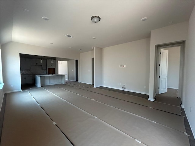 8213 Grenadier Dr, Austin, TX 78738 - unfurnished living room with baseboards