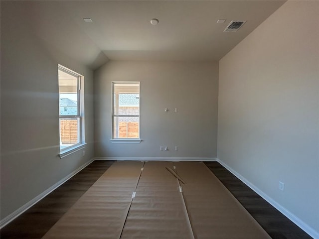 8213 Grenadier Dr, Austin, TX 78738 - unfurnished room with dark wood-type flooring, baseboards, and lofted ceiling