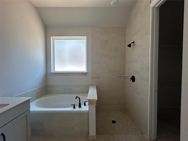 8213 Grenadier Dr, Austin, TX 78738 - full bathroom featuring a garden tub, vanity, and tiled shower