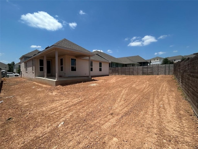 8213 Grenadier Dr, Austin, TX 78738 - rear view of property with a patio, a fenced backyard, and roof with shingles