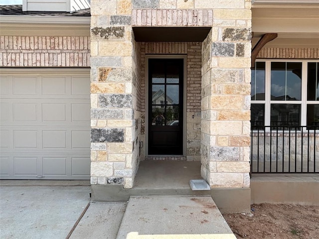8213 Grenadier Dr, Austin, TX 78738 - view of exterior entry featuring stone siding and a garage