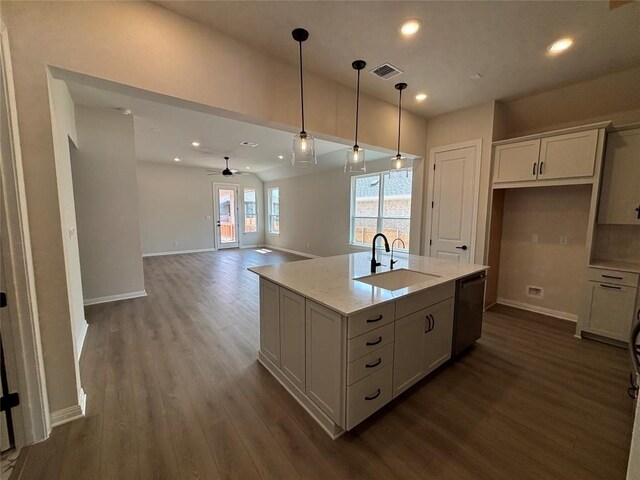 8213 Grenadier Dr, Austin, TX 78738 - kitchen with dishwasher, dark wood-style floors, ceiling fan, decorative light fixtures, and white cabinetry