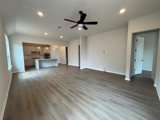 8213 Grenadier Dr, Austin, TX 78738 - unfurnished living room featuring a ceiling fan, wood finished floors, and recessed lighting