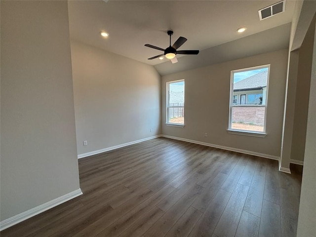8213 Grenadier Dr, Austin, TX 78738 - spare room with dark wood finished floors, a ceiling fan, vaulted ceiling, and recessed lighting