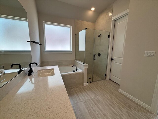 8213 Grenadier Dr, Austin, TX 78738 - bathroom featuring a bath, a stall shower, and vanity