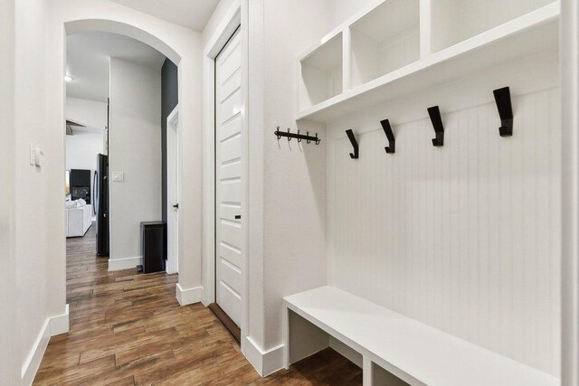 308 Somerset Hills Dr, Georgetown, TX 78633 - mudroom featuring arched walkways and wood finished floors