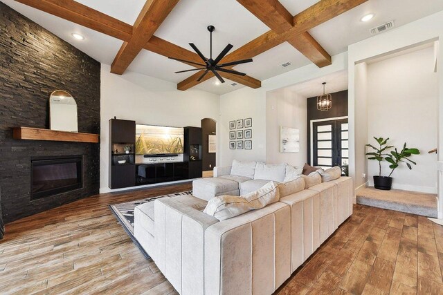 308 Somerset Hills Dr, Georgetown, TX 78633 - living area with coffered ceiling, hardwood / wood-style flooring, beamed ceiling, a large fireplace, and a ceiling fan