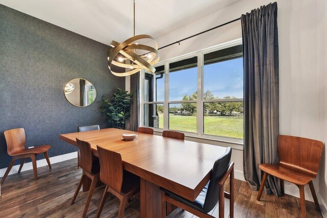 308 Somerset Hills Dr, Georgetown, TX 78633 - dining space with dark wood-style flooring, plenty of natural light, a chandelier, and an accent wall