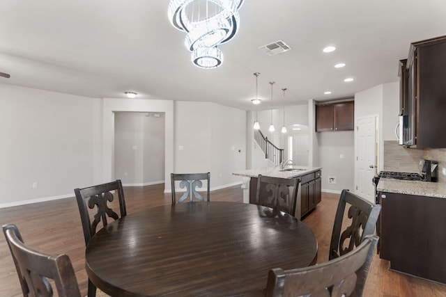 13601 Larrys Ln, Manchaca, TX 78652 - dining space featuring dark wood finished floors, recessed lighting, baseboards, and visible vents