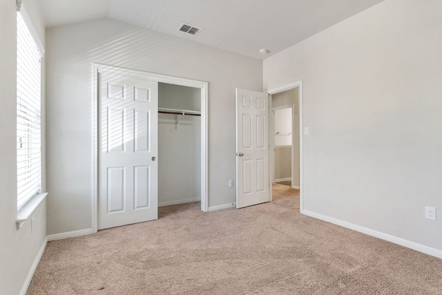 13601 Larrys Ln, Manchaca, TX 78652 - unfurnished bedroom featuring vaulted ceiling, carpet flooring, baseboards, visible vents, and a closet