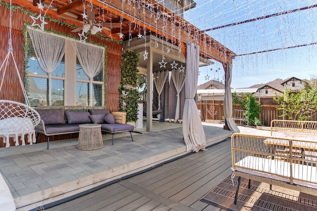 13601 Larrys Ln, Manchaca, TX 78652 - deck with a ceiling fan, an outdoor hangout area, and fence