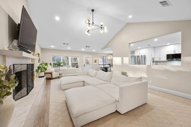 11100 Centennial Trl, Austin, TX 78726 - living area with a chandelier, a high end fireplace, recessed lighting, and high vaulted ceiling