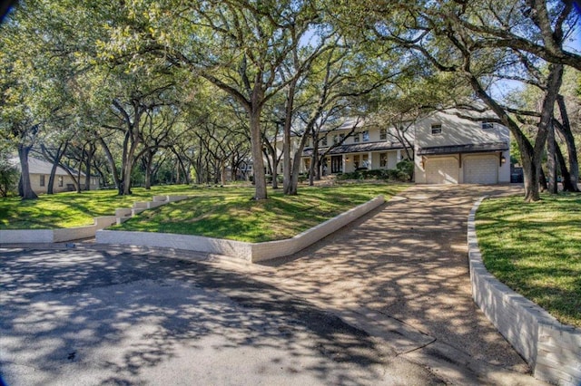 2610 Allston Ln, Austin, TX 78746 - view of front of home featuring a front yard and driveway
