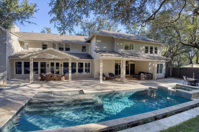 2610 Allston Ln, Austin, TX 78746 - back of property with ceiling fan, a pool with connected hot tub, a patio, and outdoor dining area