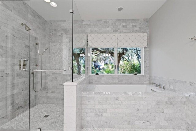 2610 Allston Ln, Austin, TX 78746 - full bathroom featuring a bath and a stall shower