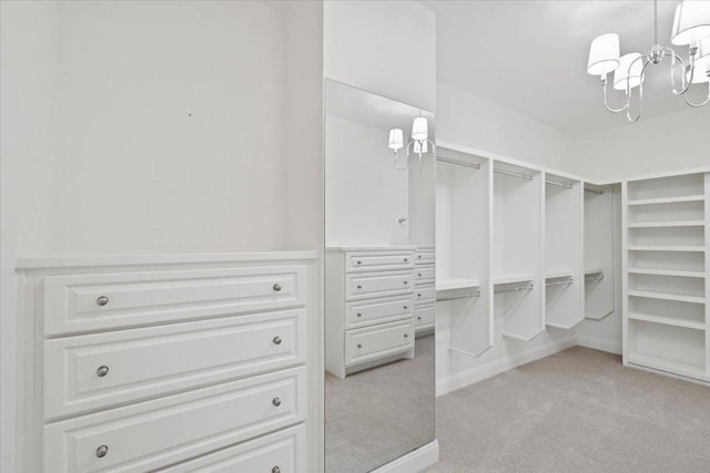 2610 Allston Ln, Austin, TX 78746 - walk in closet featuring light carpet and a chandelier