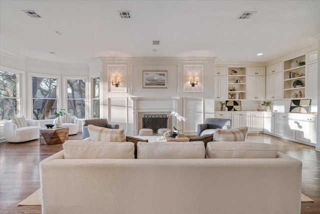 2610 Allston Ln, Austin, TX 78746 - living area with ornamental molding, wood finished floors, a fireplace, and recessed lighting