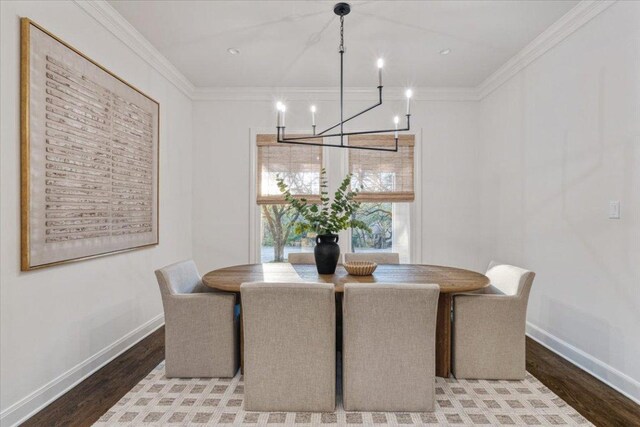 2610 Allston Ln, Austin, TX 78746 - dining area with a chandelier, wood finished floors, and ornamental molding