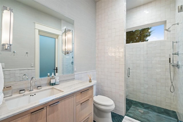 4229 Verano Dr, Austin, TX 78735 - bathroom with tile walls, a stall shower, vanity, and tile patterned floors