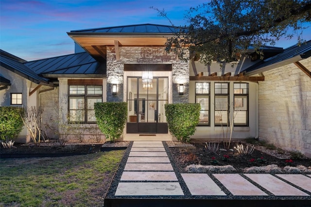 4229 Verano Dr, Austin, TX 78735 - doorway to property featuring a standing seam roof, a metal roof, stone siding, and stucco siding