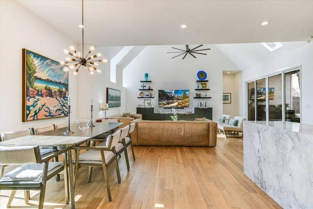 2010 Goodrich Ave Unit 8A, Austin, TX 78704 - dining area with light wood-style floors, a chandelier, recessed lighting, and high vaulted ceiling