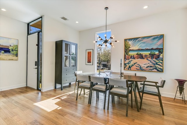2010 Goodrich Ave Unit 8A, Austin, TX 78704 - dining space featuring light wood finished floors, a chandelier, and recessed lighting