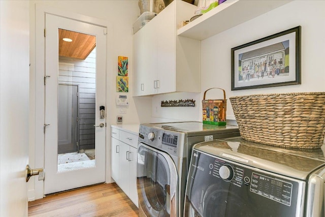 2010 Goodrich Ave Unit 8A, Austin, TX 78704 - laundry room featuring cabinet space, light wood-style floors, and washing machine and dryer