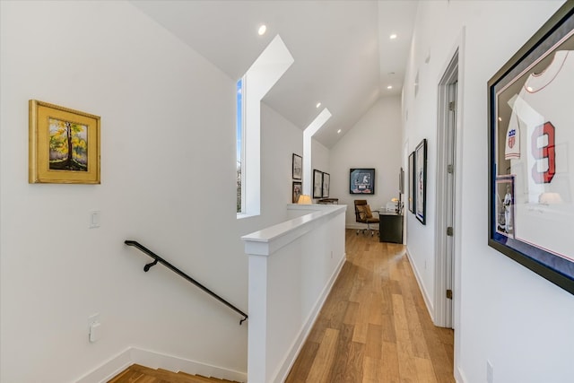 2010 Goodrich Ave Unit 8A, Austin, TX 78704 - hall featuring an upstairs landing, recessed lighting, light wood-style floors, and high vaulted ceiling