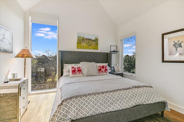 2010 Goodrich Ave Unit 8A, Austin, TX 78704 - bedroom featuring vaulted ceiling and wood finished floors