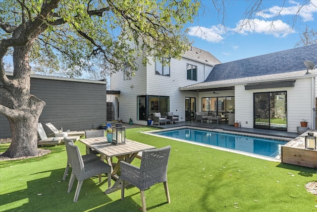 2010 Goodrich Ave Unit 8A, Austin, TX 78704 - back of house with an outdoor hangout area, a lawn, an outdoor pool, a patio area, and outdoor dining area
