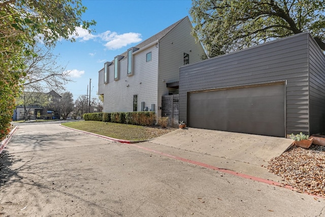 2010 Goodrich Ave Unit 8A, Austin, TX 78704 - view of property exterior with concrete driveway and an attached garage