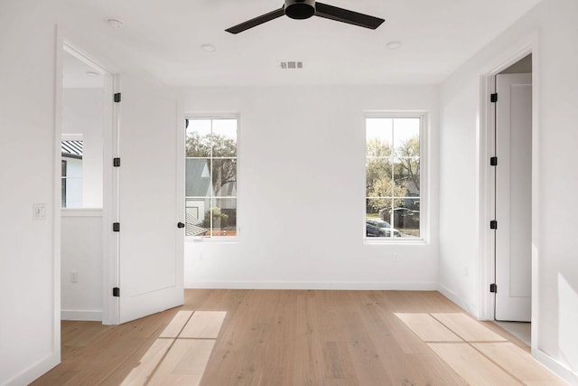 3607 Garden Villa Ln, Austin, TX 78704 - empty room featuring light wood finished floors, healthy amount of natural light, and a ceiling fan