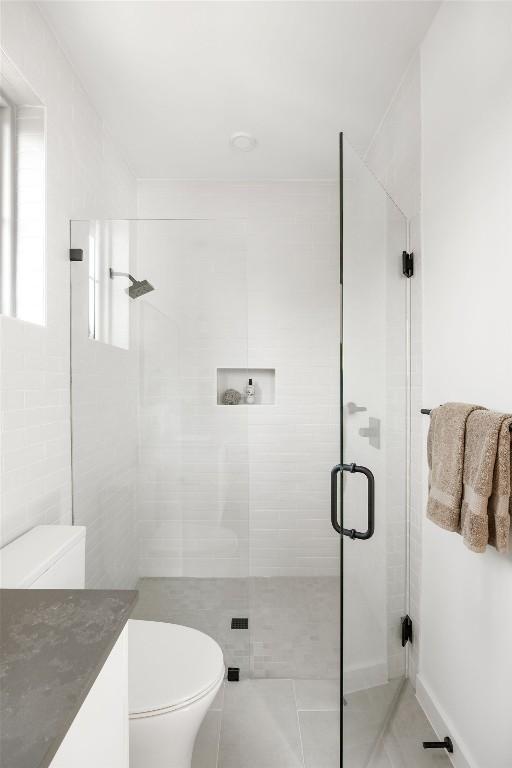 3607 Garden Villa Ln, Austin, TX 78704 - bathroom featuring a stall shower, vanity, and tile patterned flooring