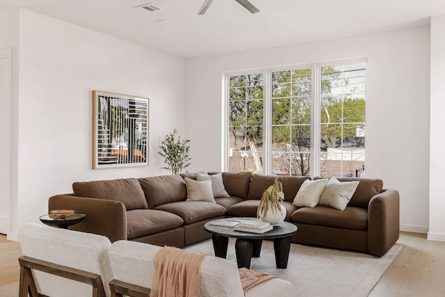 3607 Garden Villa Ln, Austin, TX 78704 - living room featuring ceiling fan, light wood-style floors, and baseboards