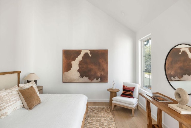 3607 Garden Villa Ln, Austin, TX 78704 - bedroom with wood finished floors, vaulted ceiling, and baseboards