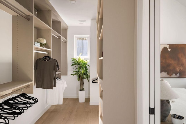 3607 Garden Villa Ln, Austin, TX 78704 - walk in closet with light wood finished floors