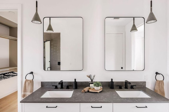 3607 Garden Villa Ln, Austin, TX 78704 - bathroom with double vanity and wood finished floors