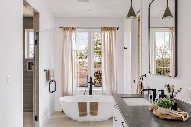 3607 Garden Villa Ln, Austin, TX 78704 - full bath with vanity, plenty of natural light, a freestanding bath, and a shower stall