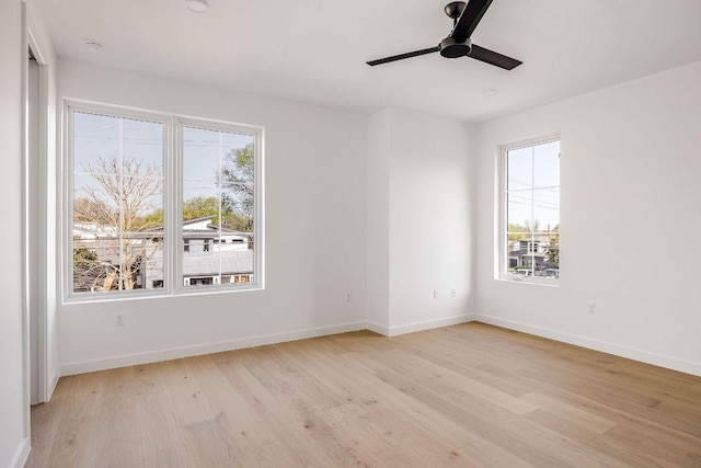 3607 Garden Villa Ln, Austin, TX 78704 - spare room featuring light wood-style floors, plenty of natural light, and a ceiling fan
