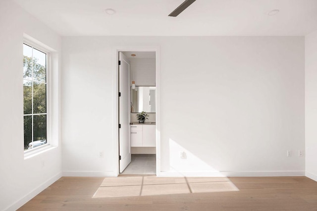 3607 Garden Villa Ln, Austin, TX 78704 - empty room featuring baseboards, light wood-type flooring, and ceiling fan